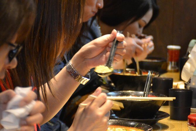 Evening Street Food Hopping Tour in Downtown Osaka - The izakaya-style stop: grilled seafood, tapas, okonomiyaki-style pancakes, and beer or sake