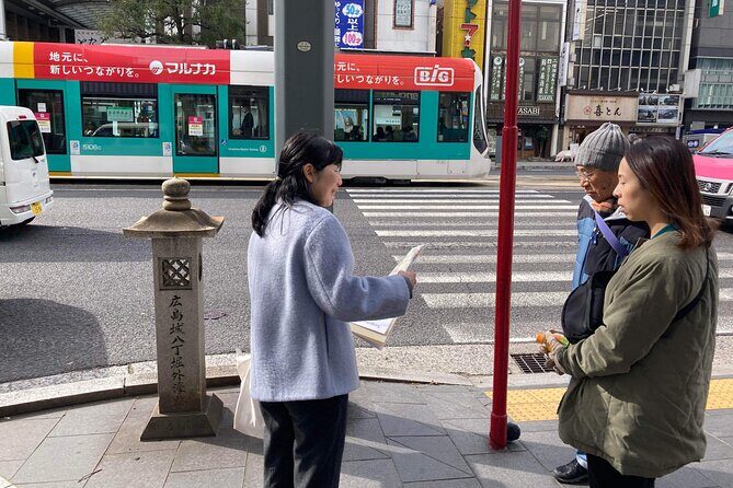 Hiroshima Local Life Walking Tour (Private) - Okonomimura: learning Hiroshima okonomiyaki while you walk through the place