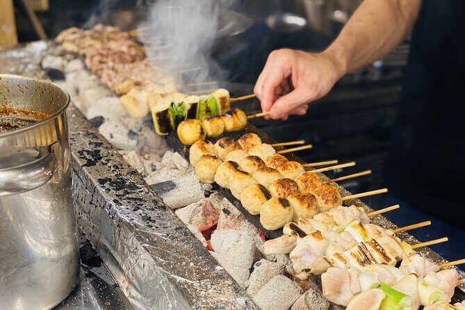 Japanese Food Experience Night Tour in Ueno - The full menu promise: about 9 dishes, ramen, sake, and a welcome drink