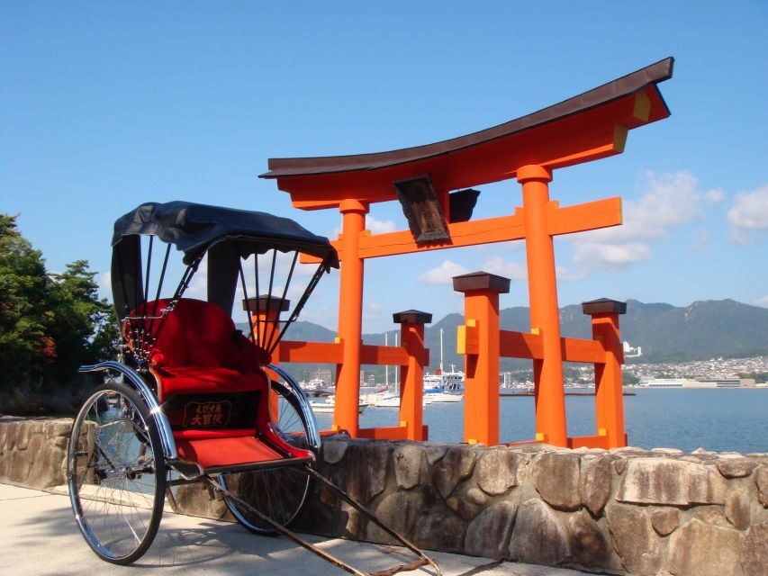 Miyajima: Private Rickshaw Tour to Itsukushima Shrine - Town streets, an old shopping arcade, and waterfront views