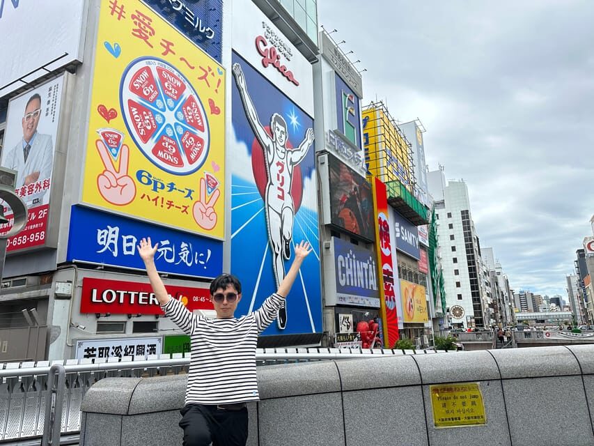 Osaka: A Private Guided Walking Tour of 5 Must-See Sights - Dotonbori: neon streets, street food time, and smart photo stops