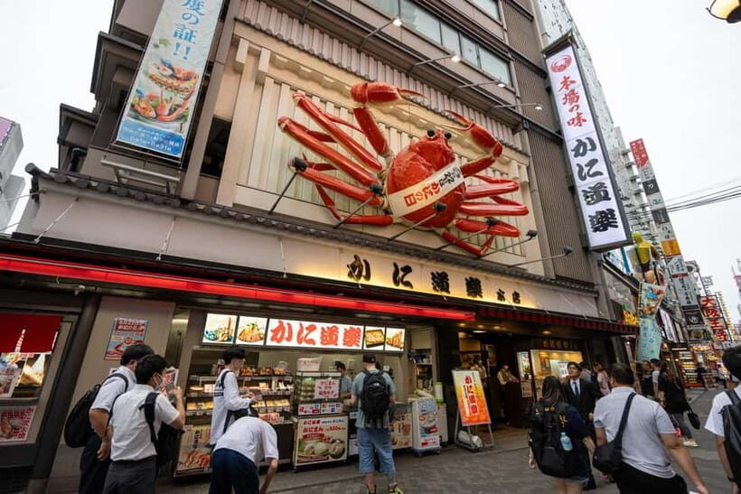 Osaka: Food Tour Kuromon Market & Dotonbori with Guide - Ebisu Bridge and the Glico sign photo stop