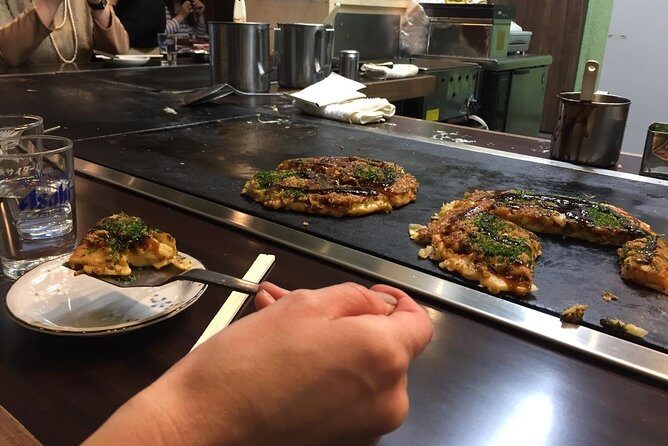 Osaka Food Walking Tour with Market Visit - The Shinsekai transition: tea, knives, and local rhythm