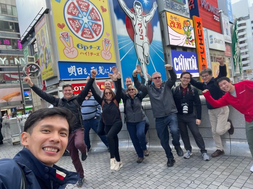 Osaka: Full-Day City Tour with a Guide and Public Transport - Osaka Castle Park and the castle entrance: a classic anchor for your day
