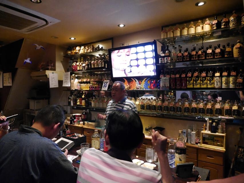 Osaka: LGBTQ+ Tour with Dinner and Drinks - Doyama’s gay-district energy: flags, niches, and the “one building, many worlds” feel