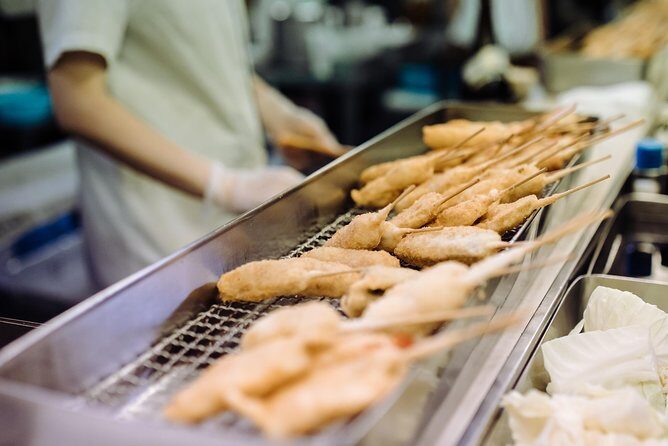 Osaka Private Food Tours by Local Foodies: 100% Personalized - Osaka’s Kitchen market stop: scallops, croquettes, and seasonal fruit