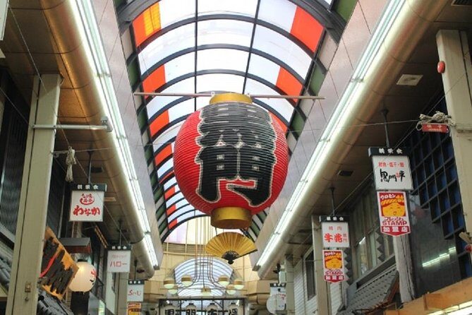 Osaka Private Tour by Public Transportation - Dotonbori in an hour: canal views, big signs, and easy walking