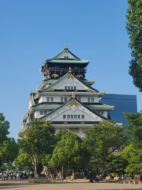 Osaka: Walking Tour and Top Highlights - Osaka Castle: big scenery, short guided stops, smart pacing
