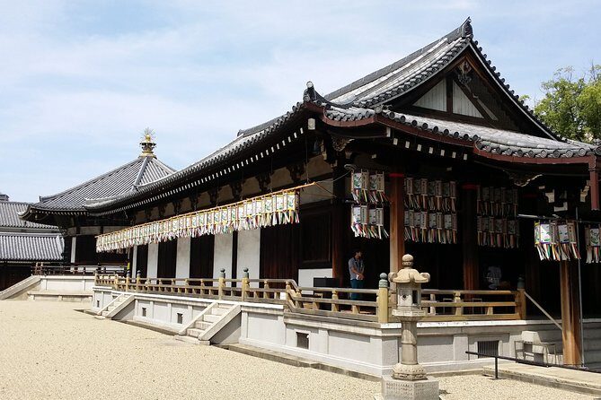 Osaka’s Best and Brightest: Private Full-Day Tour by Vehicle - Shinsekai: retro Osaka with games and street-life energy