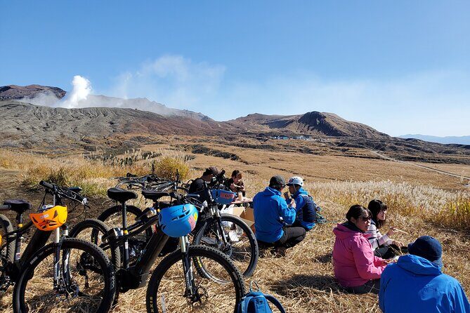 Private E-MTB guided cycling around Mt. Aso volcano & grasslands - Coming back down: the caldera opens and grasslands take over