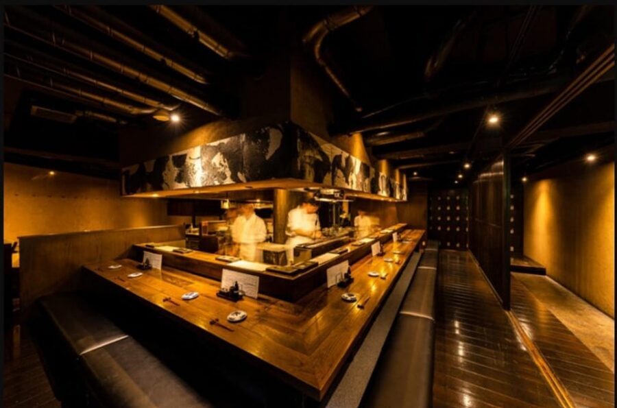Tokyo: Izakaya Bar Experience at Kuuraku Ginza Reservation - The neon-lit izakaya vibe and staff that keeps it easy