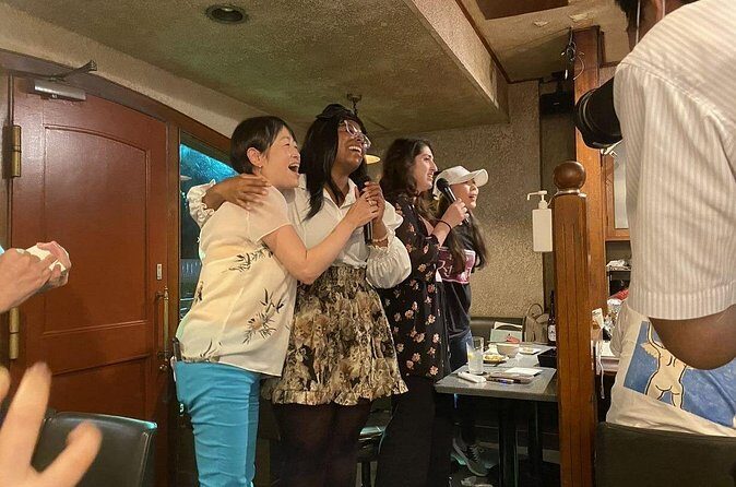 Tokyo Shinbashi Night Tour: Local Guide & Drinks at Snack Bars - Stop 4: Second snack bar plus karaoke with locals