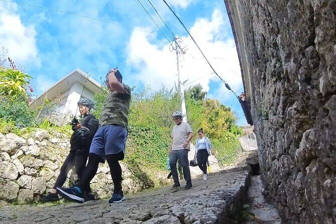 Zodiac Shrines and Naha Backstreets Cycling Tour - Shuri Kannondo: Kannon carvings and vermilion Shuri views